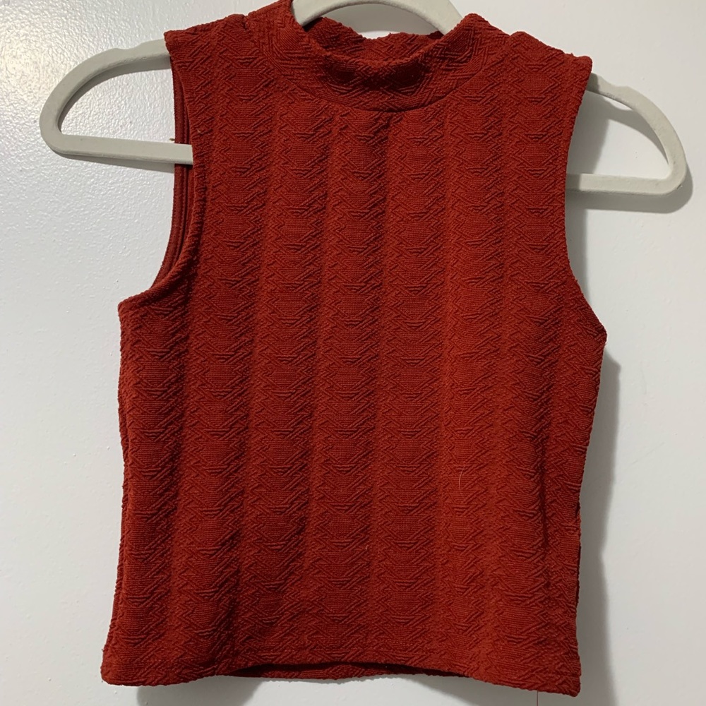 Divided orange red-ish sweaters